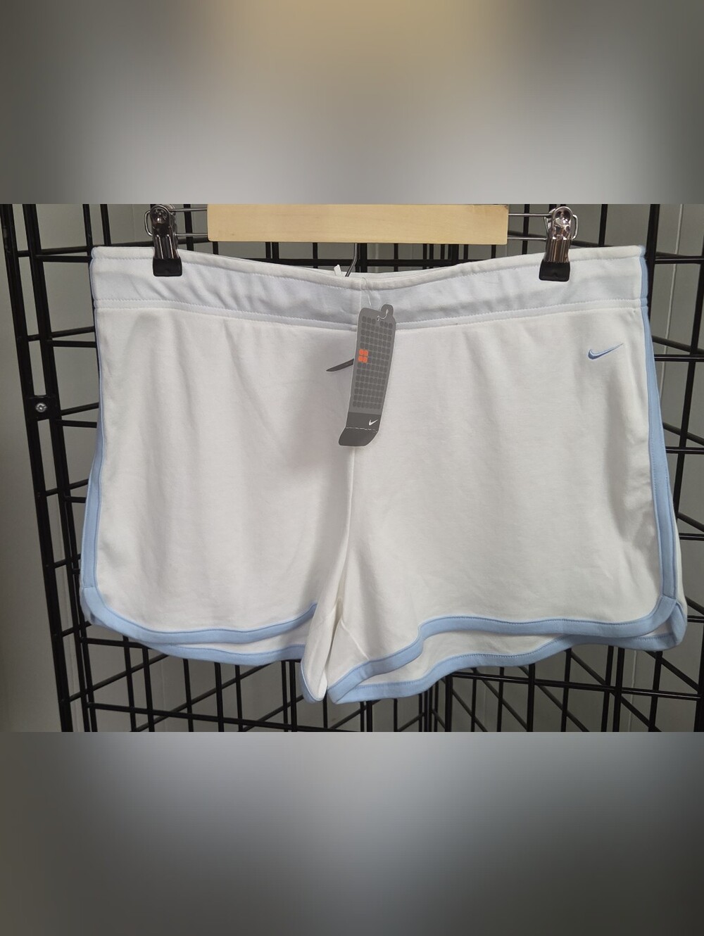 NWT Nike Women’s White Athletic Shorts with Light Blue Trim Large